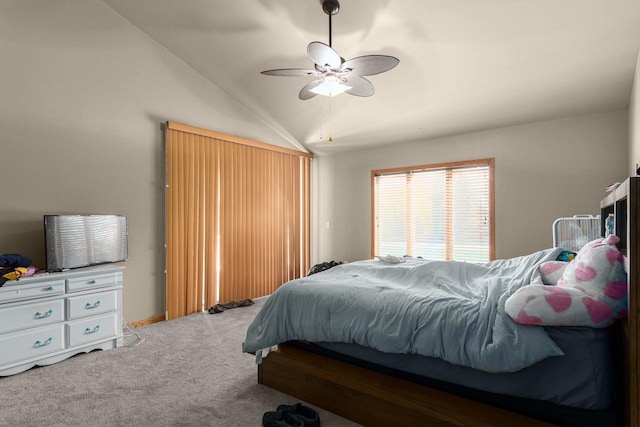 bedroom featuring ceiling fan, carpet, and vaulted ceiling