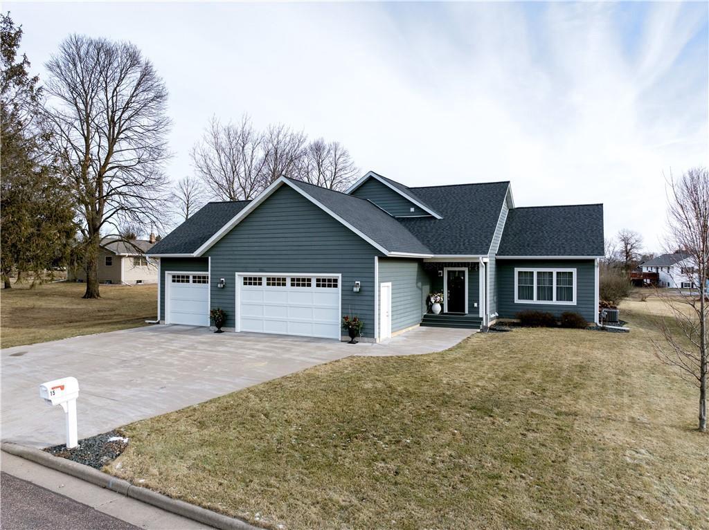 view of front of property with a front yard and a garage