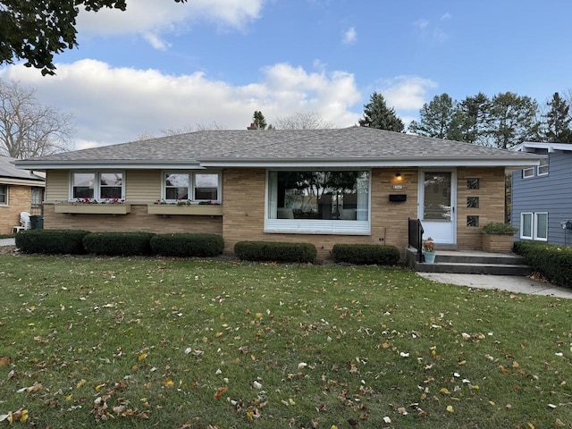 ranch-style house featuring a front yard