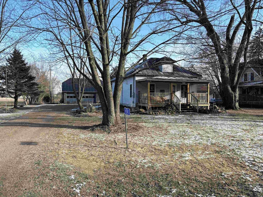 view of front facade with a garage and covered porch