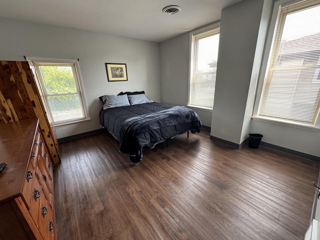 bedroom featuring dark hardwood / wood-style flooring