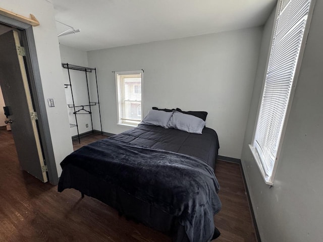 bedroom featuring dark wood-type flooring