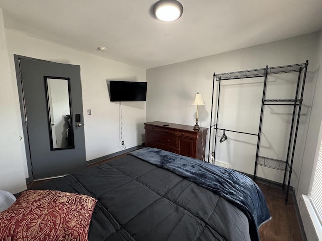 bedroom featuring dark hardwood / wood-style flooring