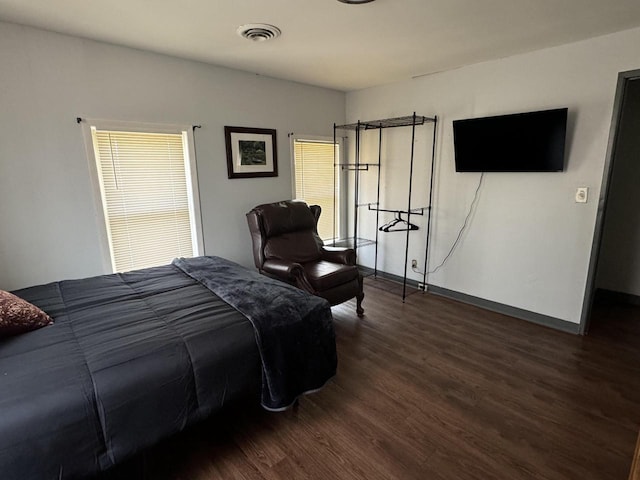 bedroom featuring dark wood-type flooring