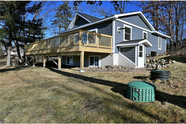 view of property exterior featuring a yard, central AC unit, and a wooden deck