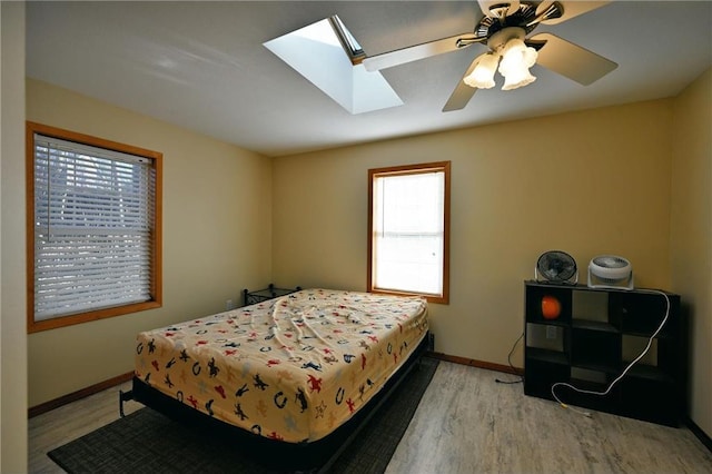 bedroom with light wood-type flooring and ceiling fan