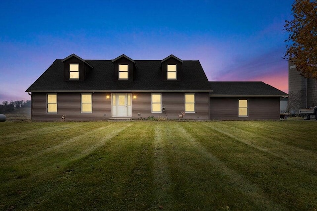 view of front of house featuring a lawn