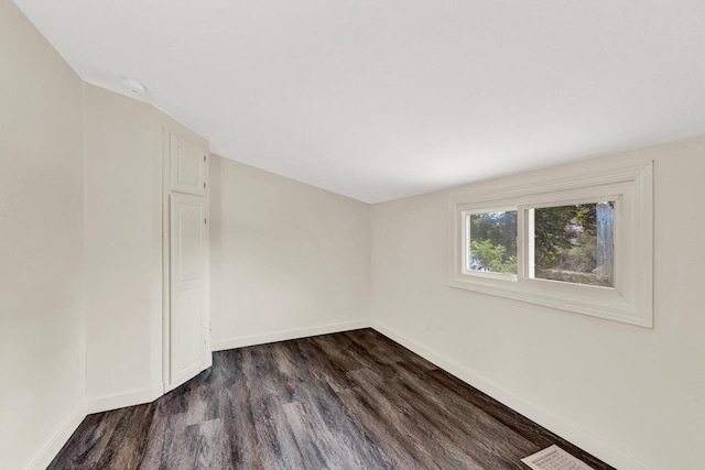 empty room featuring dark hardwood / wood-style floors