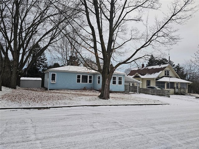 view of front of home with an outdoor structure