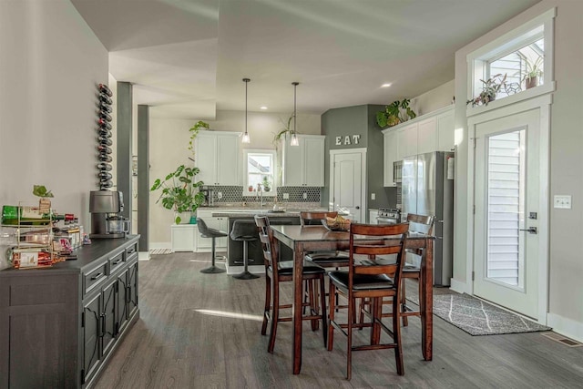 dining room with dark wood-type flooring