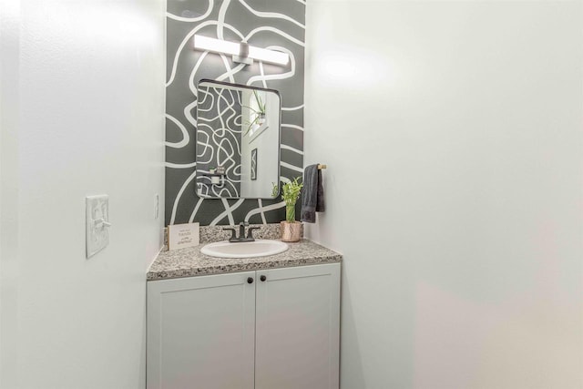 bathroom with vanity and backsplash