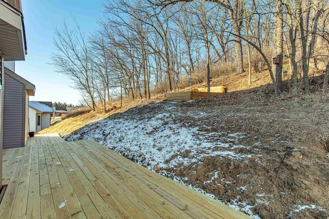 yard covered in snow featuring a wooden deck