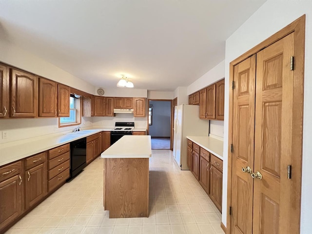 kitchen with white appliances, a center island, and sink