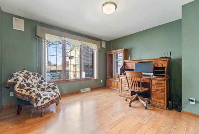 office space with light hardwood / wood-style flooring