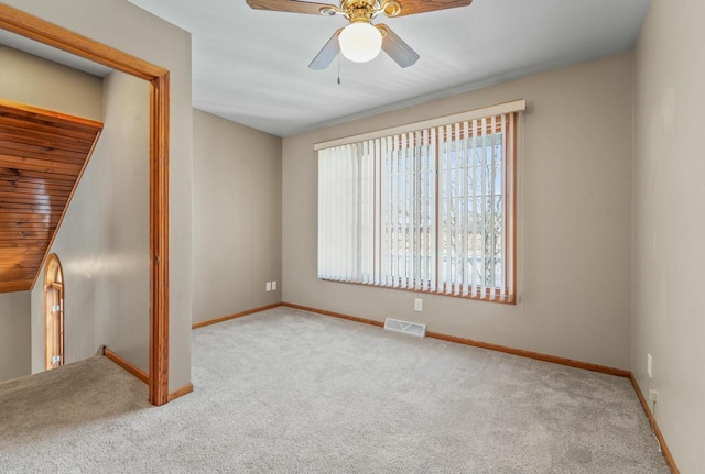 interior space featuring ceiling fan, a wealth of natural light, and wood ceiling