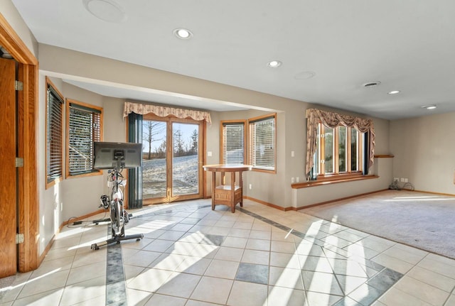 workout area with light tile patterned floors