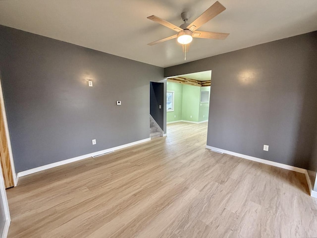 spare room featuring ceiling fan and light wood-type flooring