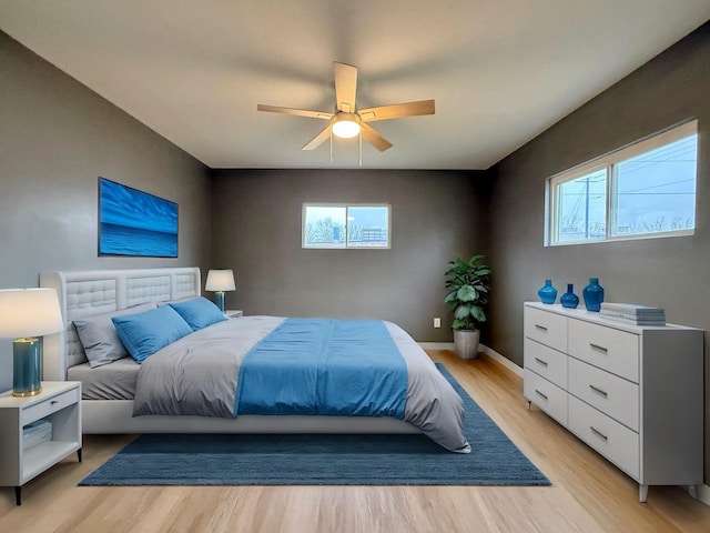 bedroom featuring light hardwood / wood-style flooring and ceiling fan