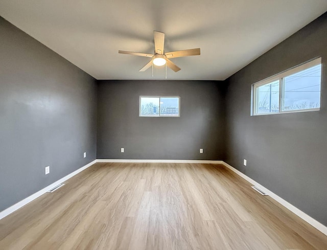 unfurnished room featuring ceiling fan and light hardwood / wood-style floors