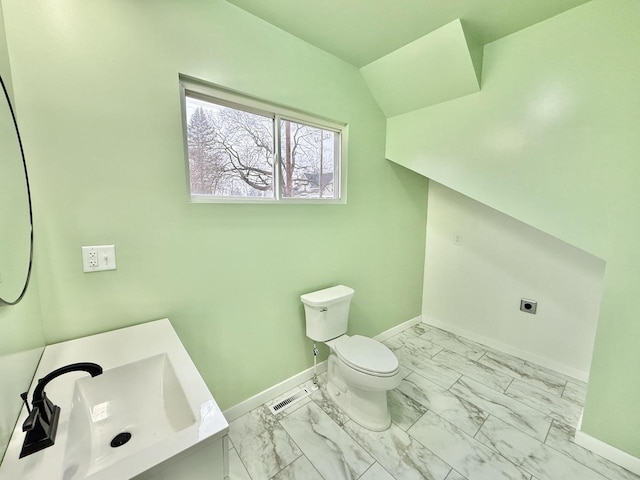 bathroom with toilet and sink