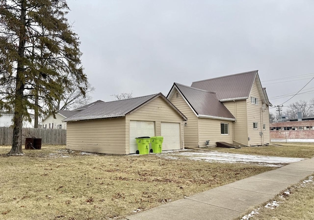 view of side of property with a garage