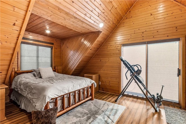 bedroom featuring wooden walls, wooden ceiling, lofted ceiling, and light wood-type flooring