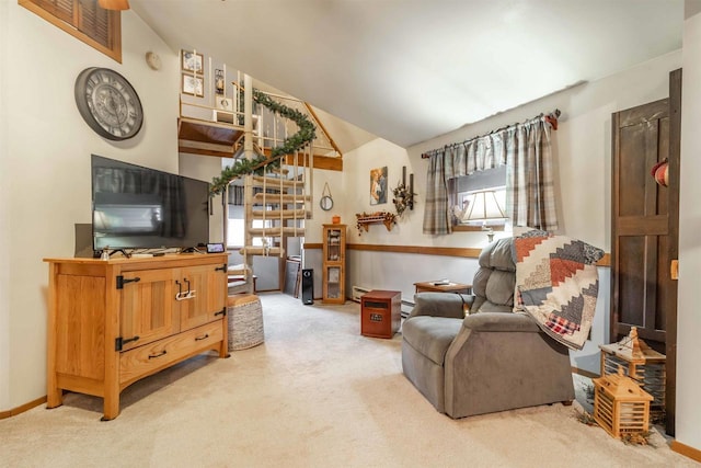 carpeted living room featuring lofted ceiling and a baseboard radiator