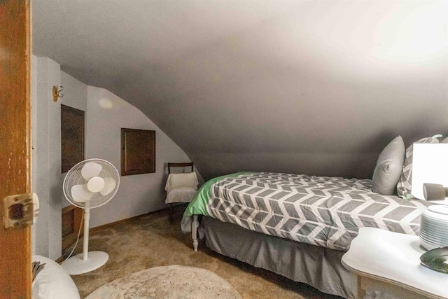 carpeted bedroom featuring lofted ceiling