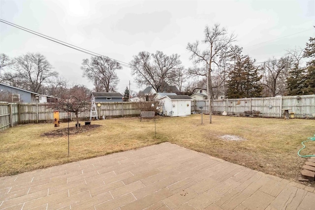 view of yard featuring an outbuilding and a patio