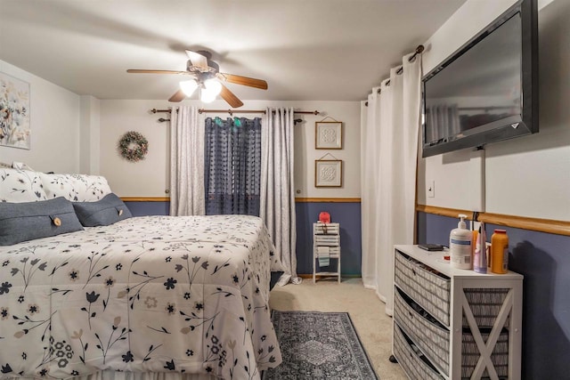 bedroom with light colored carpet and ceiling fan