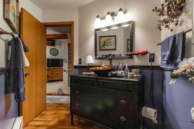 bathroom featuring vanity and hardwood / wood-style flooring