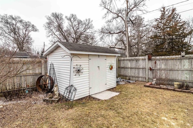 view of outbuilding with a yard