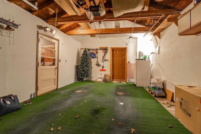 interior space featuring wood ceiling and a garage door opener