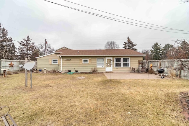 rear view of house with a patio area and a yard