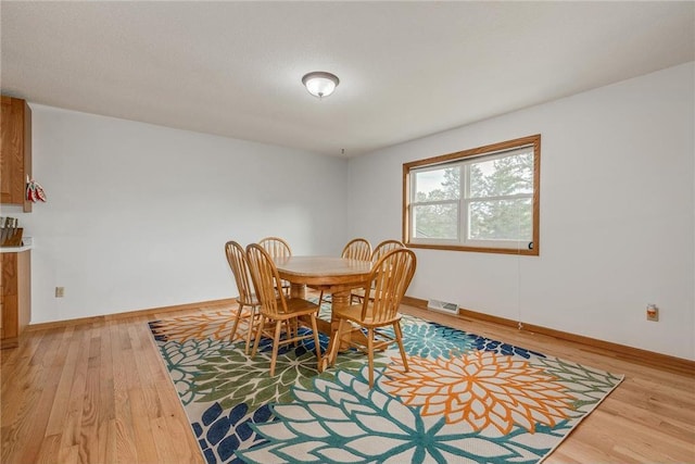 dining area featuring hardwood / wood-style floors