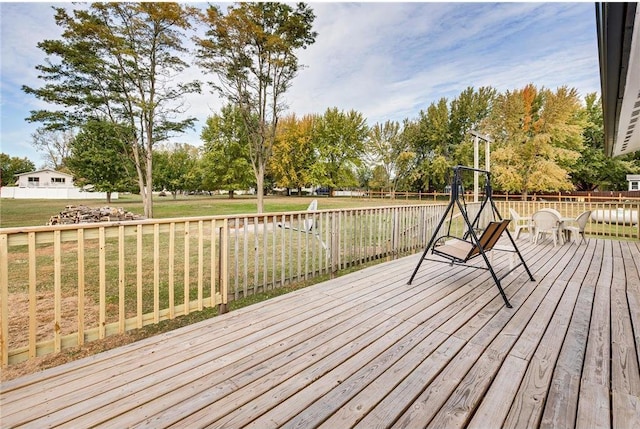 wooden terrace with a yard