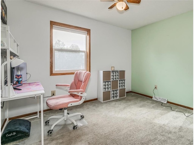 home office featuring ceiling fan and carpet