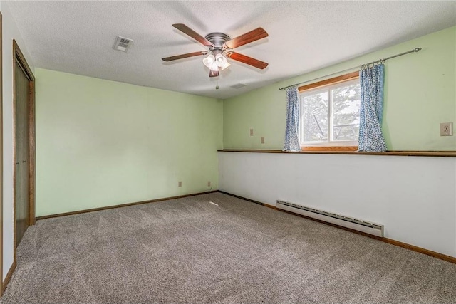 unfurnished room featuring carpet flooring, ceiling fan, a baseboard radiator, and a textured ceiling