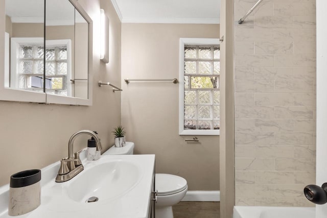 full bathroom with vanity, toilet, plenty of natural light, and crown molding