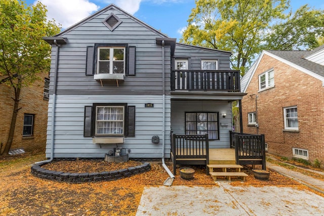 rear view of house featuring a balcony