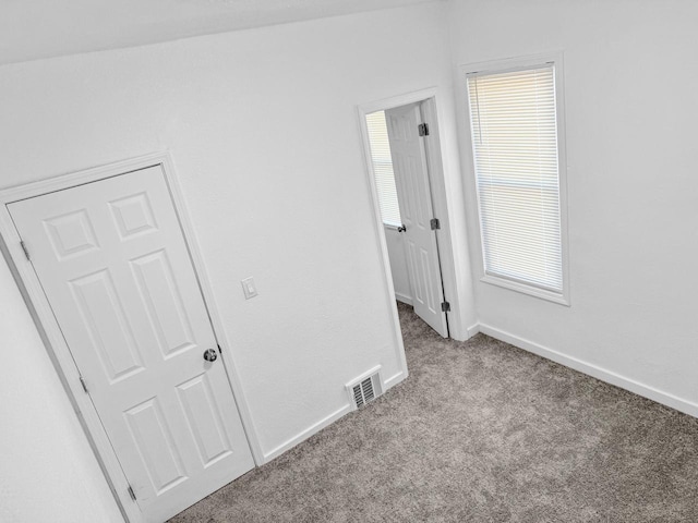 view of carpeted spare room