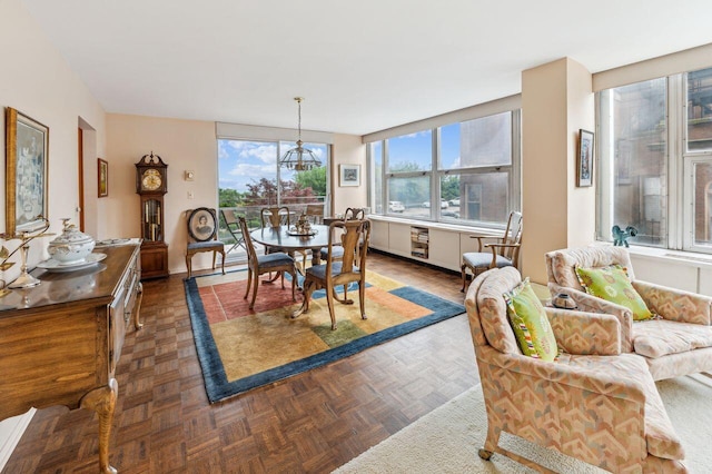 dining room featuring dark parquet flooring