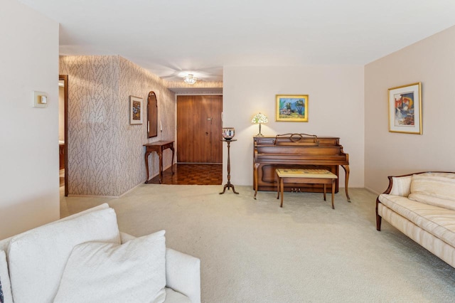 carpeted living room featuring wooden walls