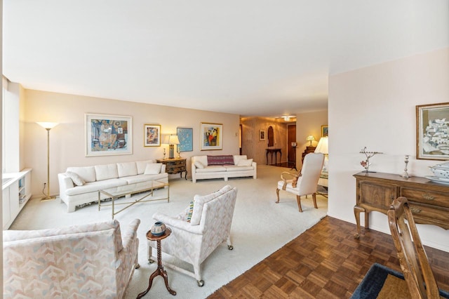 living room featuring dark parquet floors