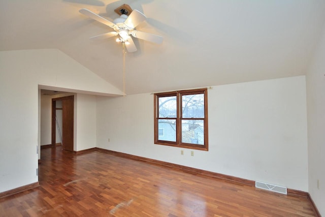 bonus room featuring ceiling fan, dark hardwood / wood-style flooring, and vaulted ceiling