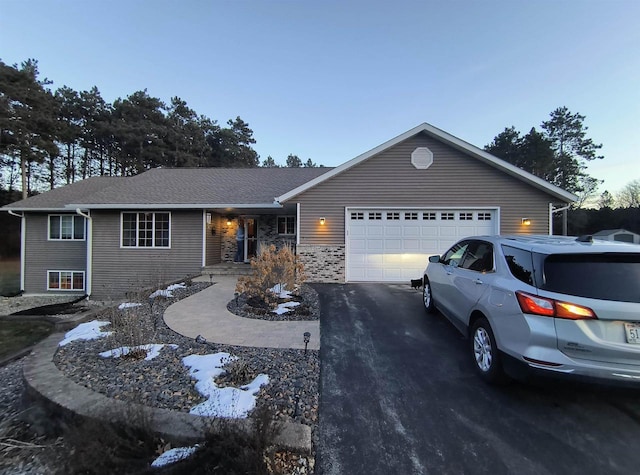 ranch-style home with a garage