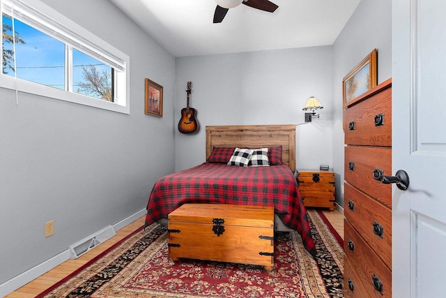 bedroom featuring ceiling fan and wood-type flooring