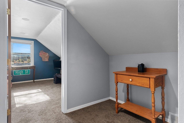 additional living space with carpet flooring and lofted ceiling