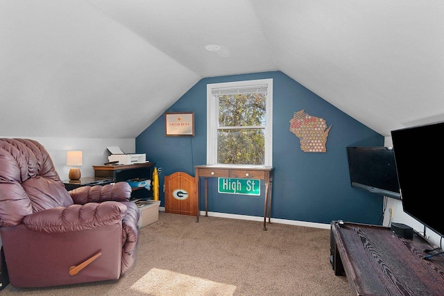 interior space with carpet floors and vaulted ceiling