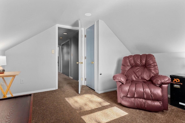 living area with carpet flooring and lofted ceiling